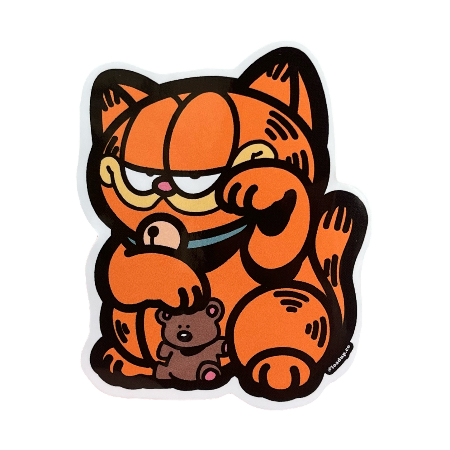 Garfield Neko Sticker of an orange cat holding a teddy bear in a lucky cat maneki-neko pose.