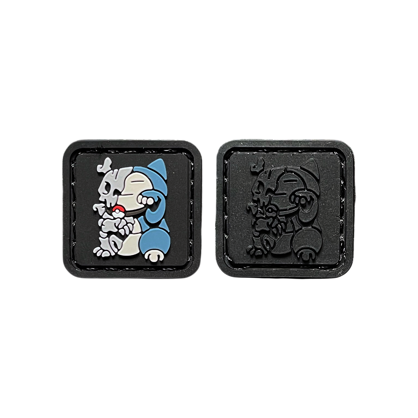 Myke Cruz x LOADUP Skull Neko RE Set PVC ranger eye morale patches of a green monster with bones sticking out sitting in a lucky cat maneki neko pose. The other patch is the same character but fully blacked out in color.