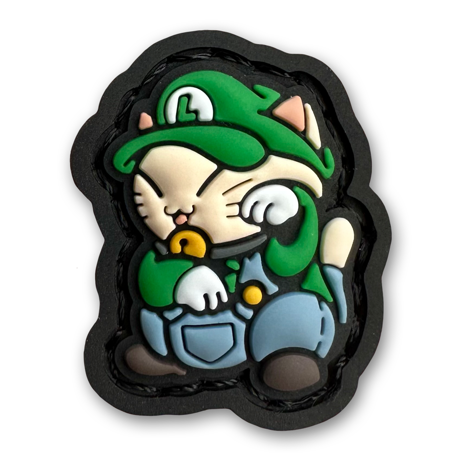Luigi Neko RE PVC ranger eye morale patch of a cartoon character with a green hat and overalls sitting in a lucky cat maneki-neko pose.