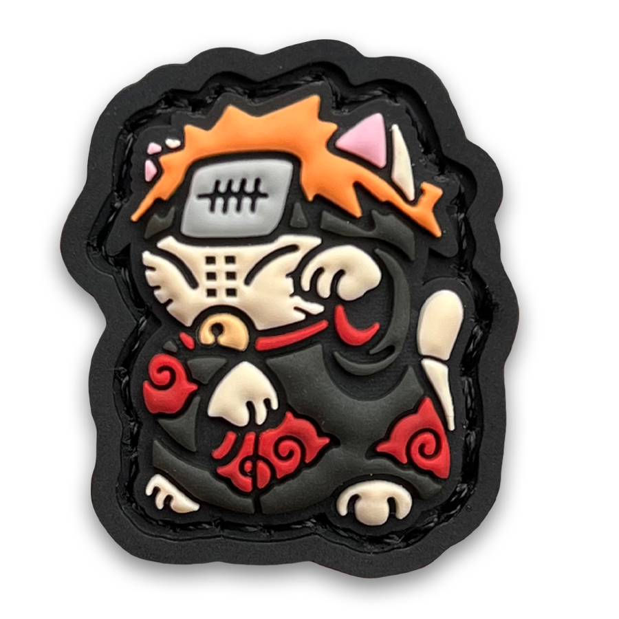 Pain Neko RE PVC ranger eye morale patch of an orange haired anime character wearing a black robe with red clouds sitting in a lucky cat maneki-neko pose.