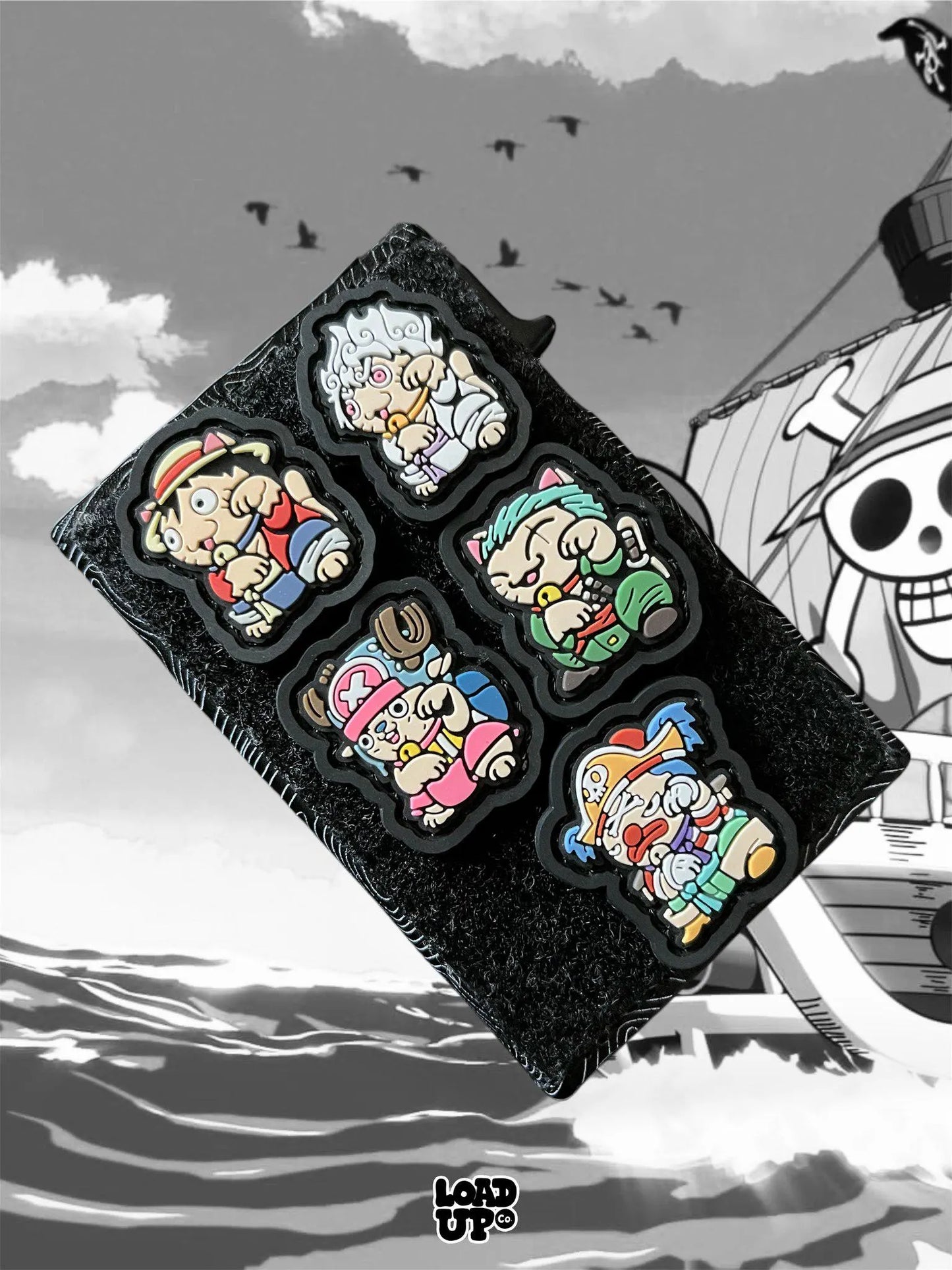 Pirate Neko REs on a velcro wallet with an ocean and ship black and white background.