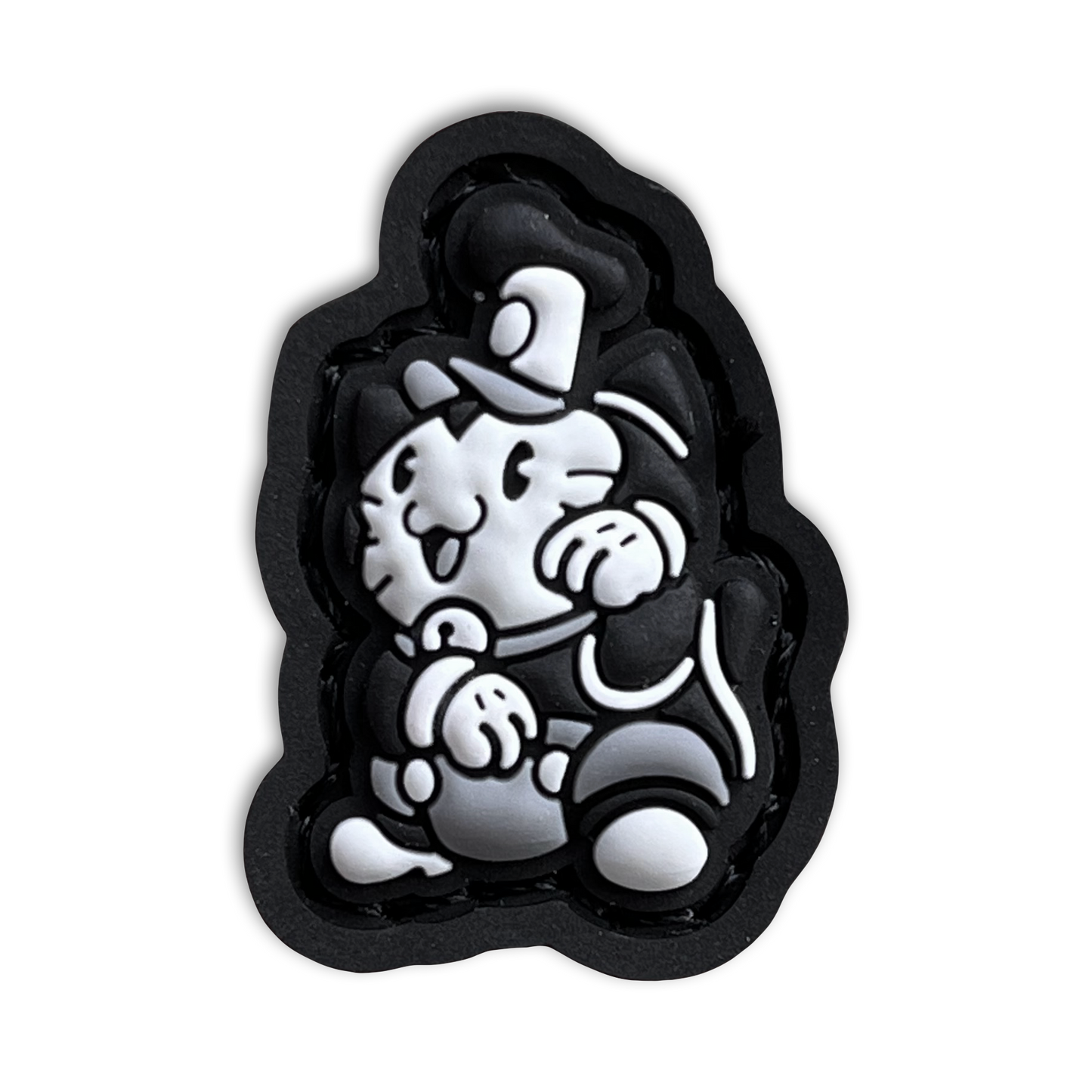 Steamboat Willie Neko RE PVC ranger eye morale patch of a black and white mouse cartoon character wearing a hat sitting in a lucky cat maneki-neko pose.