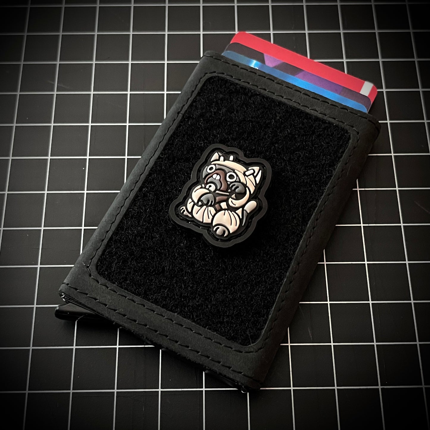 Tusken Raider Neko RE PVC ranger eye morale patch on a velcro wallet and grid background.