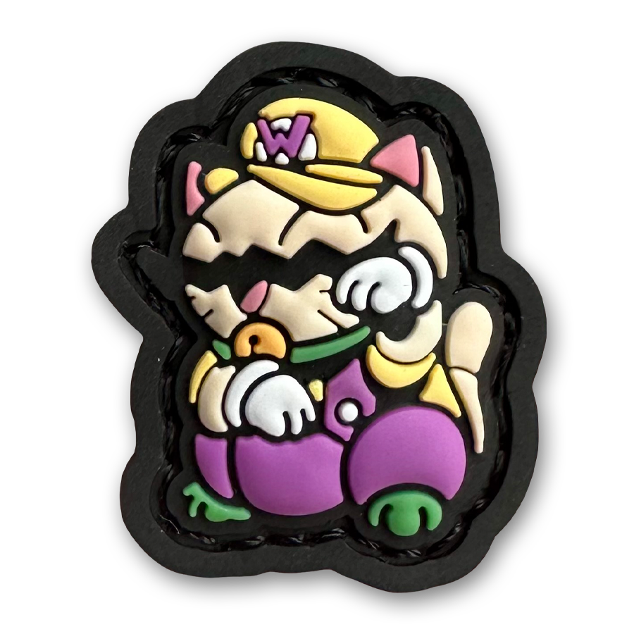 Wario Neko RE PVC ranger eye morale patch of a cartoon character with a mustache and yellow and purple clothes sitting in a lucky cat maneki-neko pose.