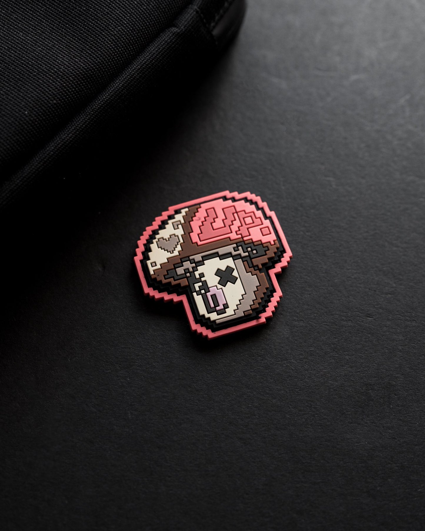 Pixelated mushroom design on a black background