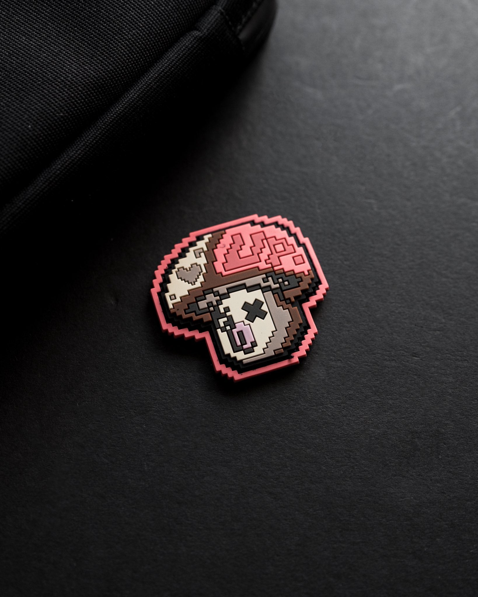 Pixelated mushroom design on a black background