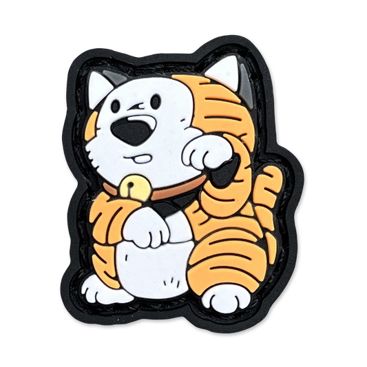 Comic Tiger Neko RE ranger eye pvc morale patch depicting a cartoon tiger in a lucky cat maneki neko pose.
