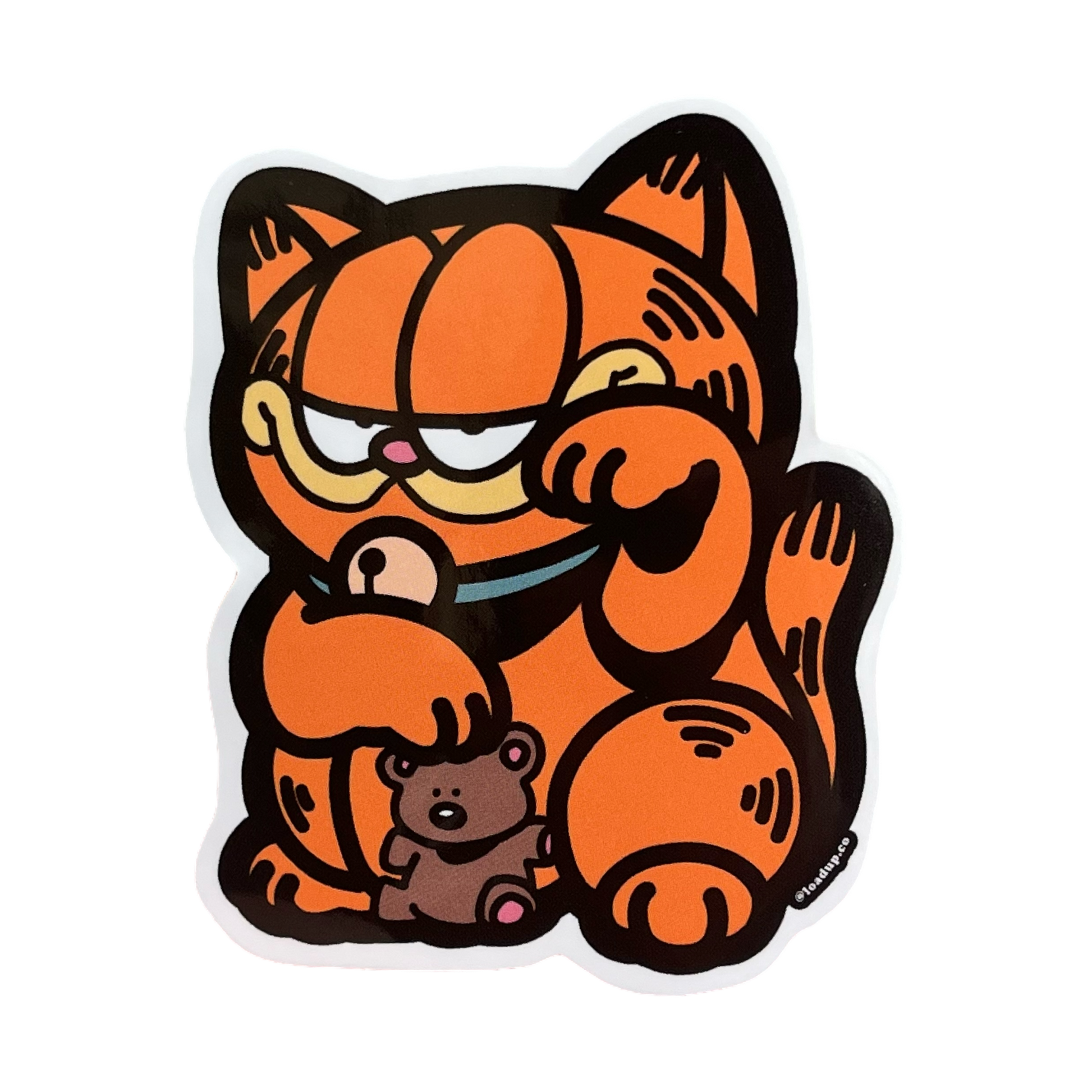 Garfield Neko Sticker of an orange cat holding a teddy bear in a lucky cat maneki-neko pose.