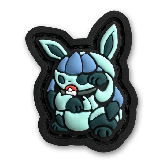 Ice Monster Neko RE PVC ranger eye morale patch of a blue monster character sitting in a lucky cat maneki-neko pose.