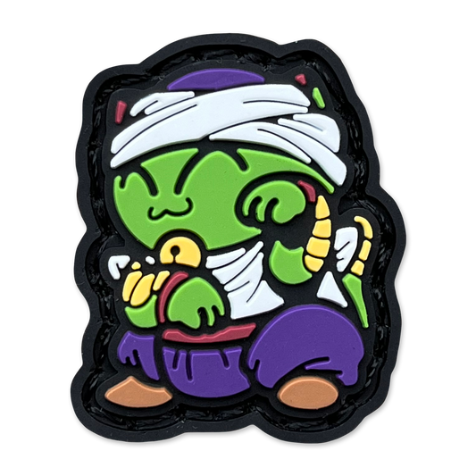 Namek Guardian Neko RE ranger eye pvc morale patch of Colorful cartoon character with green skin, purple outfit, and white headband on a black border.