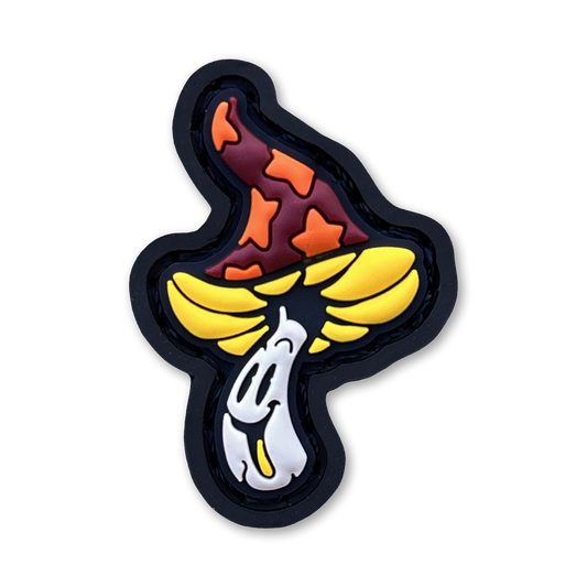 Shroomie RE - Fire PVC ranger eye morale patch of a smiling mushroom character with an orange and yellow cap.
