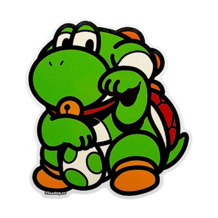 Yoshi Neko Sticker depicting a green cartoon character holding an egg in a lucky cat maneko pose.