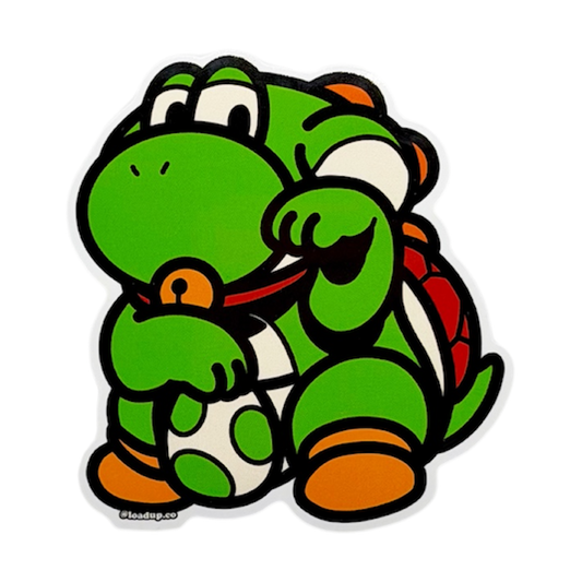 Yoshi Neko Sticker depicting a green cartoon character holding an egg in a lucky cat maneko pose.