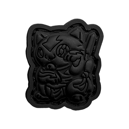 Aang Neko Blackout RE PVC ranger eye patch of a cartoon character in a lucky cat maneko pose.