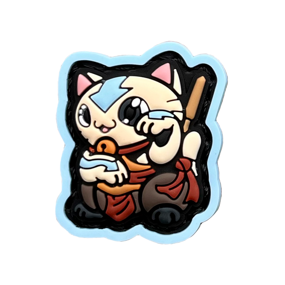 Aang Neko RE PVC ranger eye velcro patch of a cartoon character with a blue arrow sitting in a lucky cat maneki-neko pose.