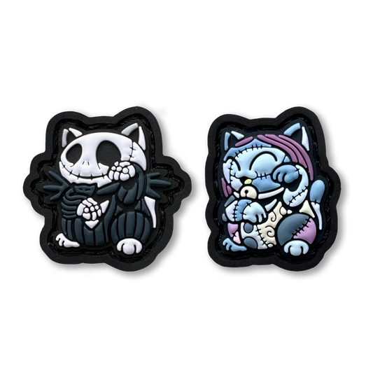 Bone King & Rag Doll Neko RE Set PVC ranger eye morale patches of a Halloween Christmas skeleton character in a black suit and blue patchy girl sitting in a lucky cat maneki-neko pose.
