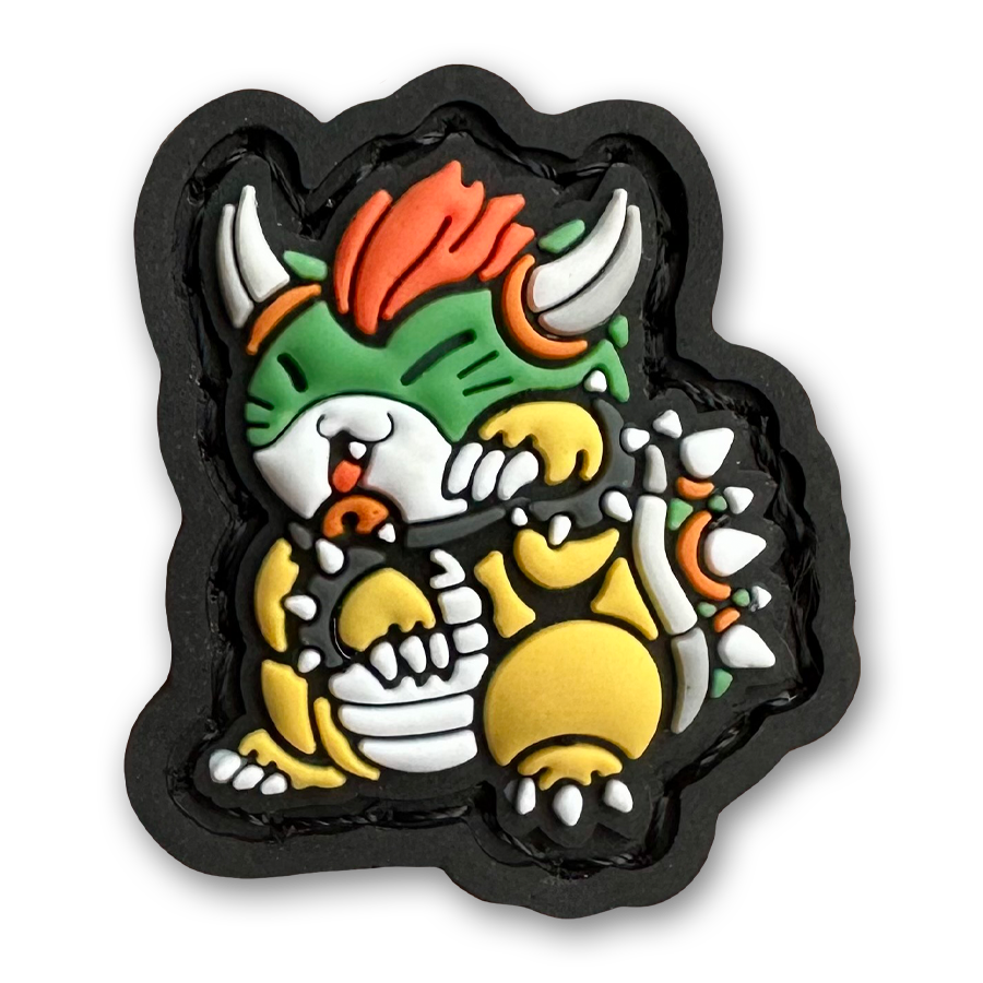 Bowser Neko RE PVC ranger eye morale patch of a green monster with horns and spiky shell standing in a lucky cat maneki-neko pose.