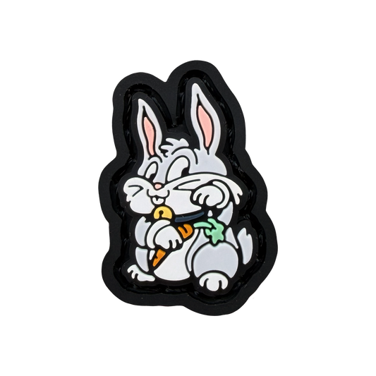 Bunny Neko RE ranger eye PVC morale patch of a bunny holding a carrot sitting in a lucky cat maneki neko pose.