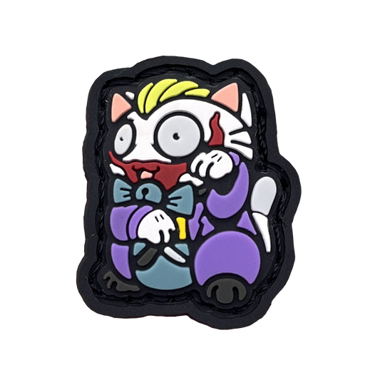 Chaos Clown Neko RE PVC ranger eye morale patch of a character wearing a purple suit holding a knife sitting in a lucky cat maneki-neko pose.