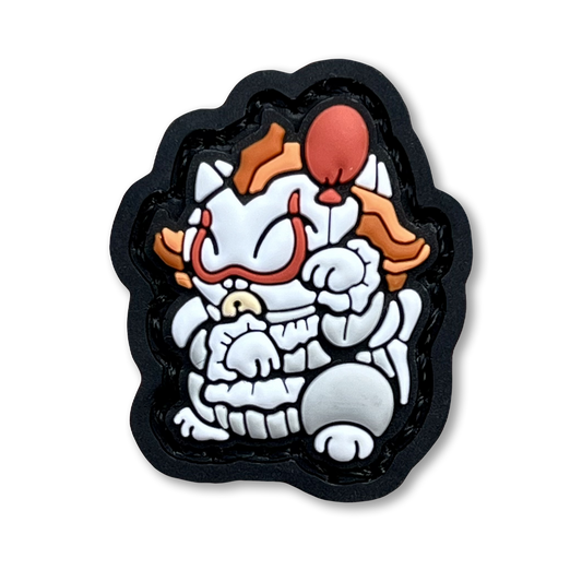 Clown Neko RE PVC ranger eye morale patch of a white and orange clown in a lucky cat maneki-neko pose.