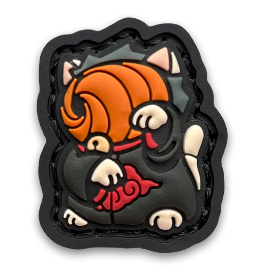 Daybreak 2 Neko RE PVC ranger eye morale patch of a character in an orange mask and robe with red clouds sitting in a lucky cat maneki-neko pose.