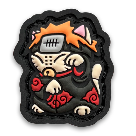 Daybreak 3 Neko RE PVC ranger eye morale patch of an orange haired anime character wearing a black robe with red clouds sitting in a lucky cat maneki-neko pose.