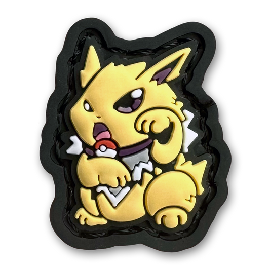Electric Monster Neko RE PVC ranger eye morale patch of a yellow monster anime character sitting in a lucky cat maneki-neko pose.