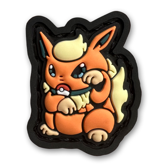 Fire Monster Neko RE PVC ranger eye morale patch of an orange monster character sitting in a lucky cat maneki-neko pose.