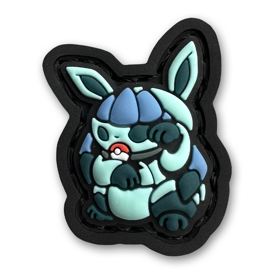 Glaceon Neko RE PVC ranger eye morale patch of a blue monster character sitting in a lucky cat maneki-neko pose.