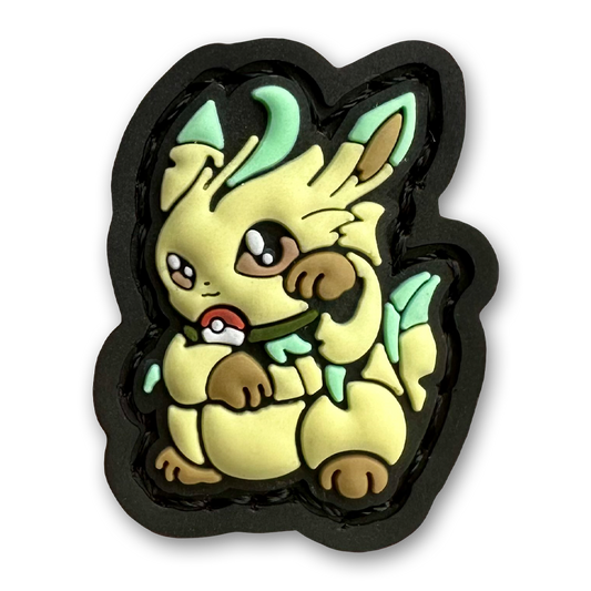Grass Monster Neko RE PVC ranger eye morale patch of a green monster sitting in a lucky cat maneki-neko pose.