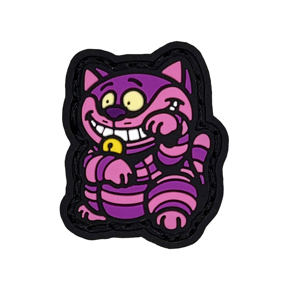 Grinning Cat Neko RE PVC ranger eye morale patch of a purple and pink cat sitting in a lucky cat maneki-neko pose.