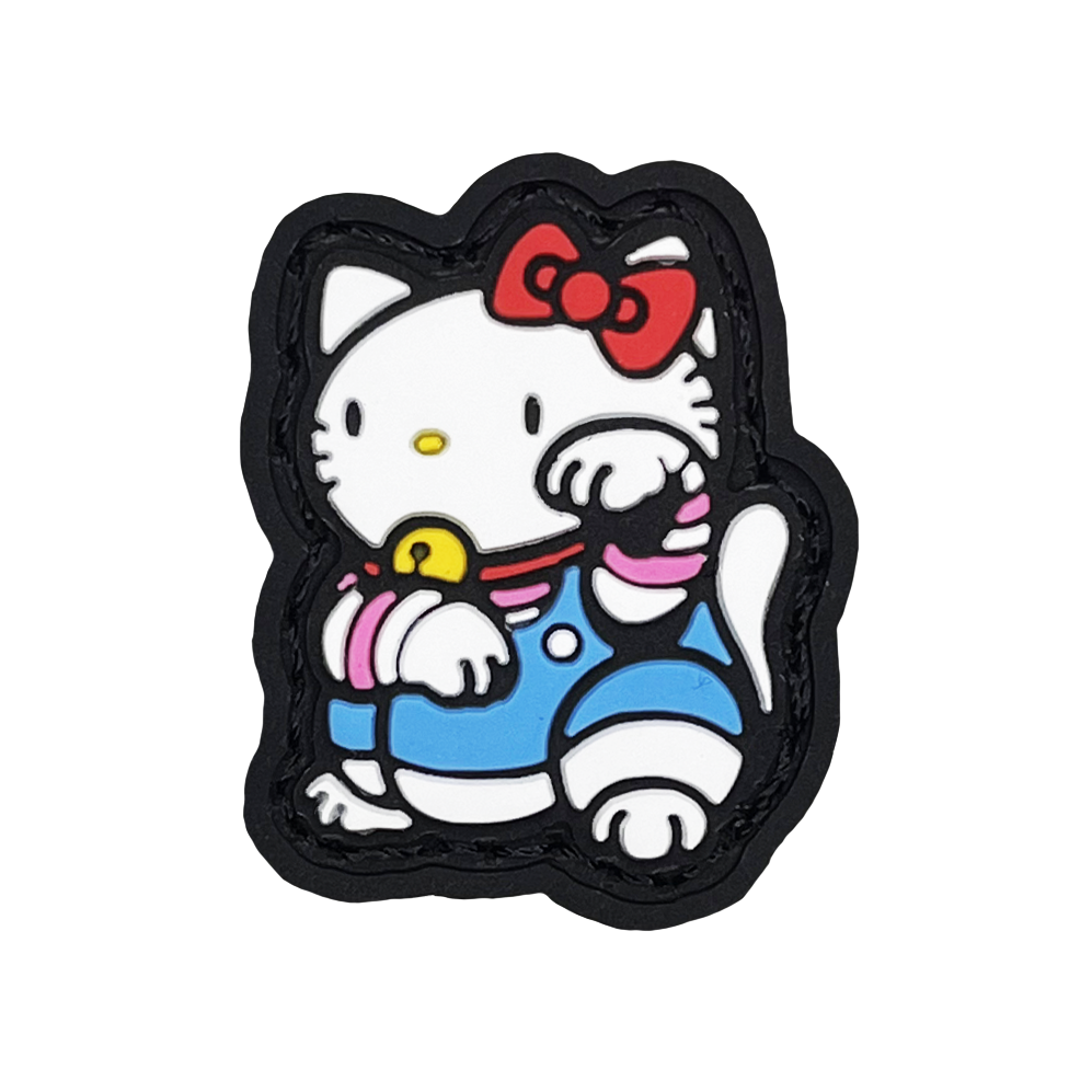 Hello Kitty Neko RE PVC ranger eye morale patch of a white cat wearing a red bowtie and blue clothes sitting in a lucky cat maneki-neko pose.