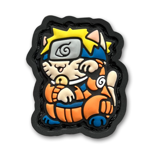 Hidden Leaf Ninja 1 Neko RE of a blond anime cartoon character in orange jumpsuit sitting in a lucky cat maneki-neko pose.