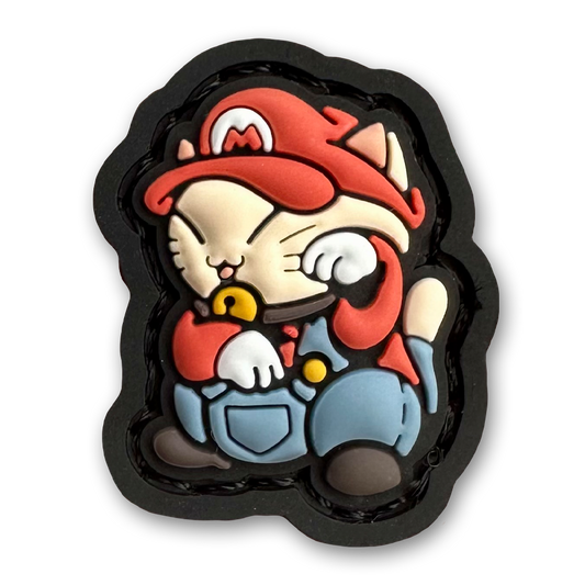Italian Neko 1 RE PVC ranger eye morale patch of a character wearing a red hat and overalls sitting in a lucky cat maneki-neko pose.