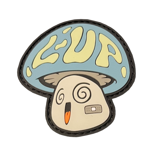 LoadUp Mushroom RE PVC ranger eye morale patch - A mushroom character with the letters "L-UP" on the cap. Has swirly eyes, open smiling mouth, and a band-aid on its cheek. Cap is blue, L-UP is yellow, face is gray.