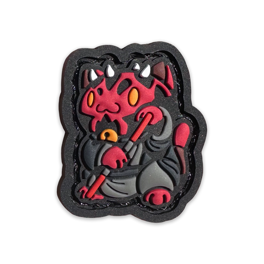 Maul Neko RE PVC ranger eye morale patch of a red cartoon character with a black outfit and red sword sitting in a lucky cat maneki-neko pose.