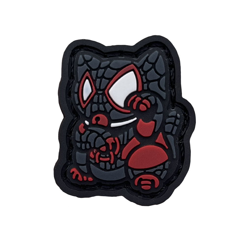 Miles Morales Neko RE PVC ranger eye morale patch of a superhero character in black and red clothing sitting in a lucky cat maneki-neko pose.
