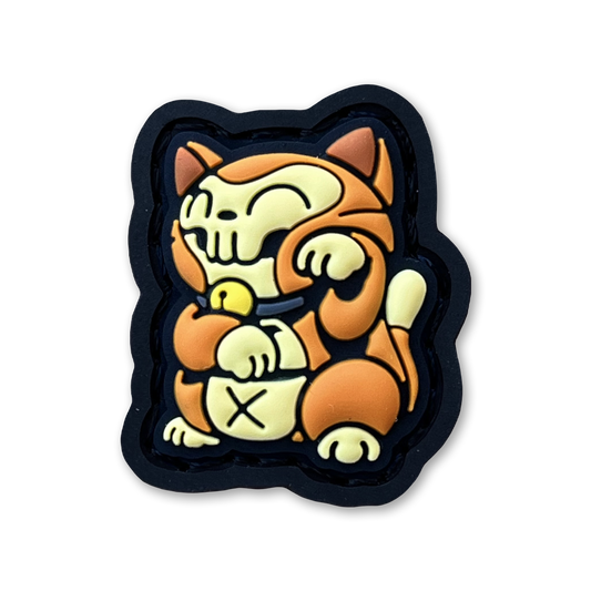 Orange Cat Neko RE PVC ranger eye morale patch of an orange and yellow cat sitting in a lucky cat maneki-neko pose.