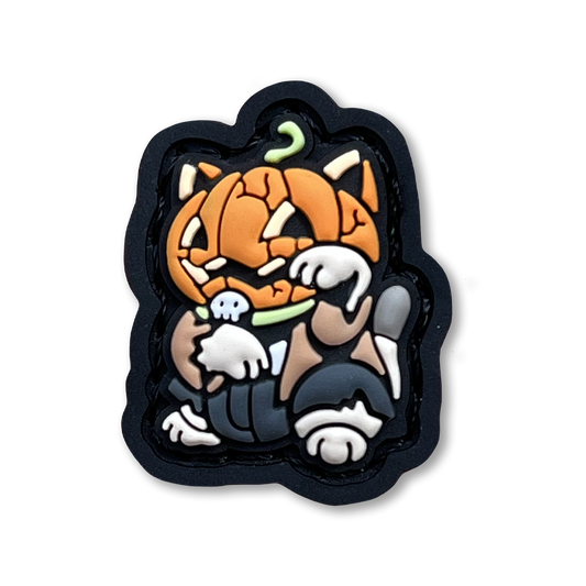 Pumpkin Neko RE PVC ranger eye morale patch of a character with a pumpkin head sitting in a lucky cat maneki-neko pose.