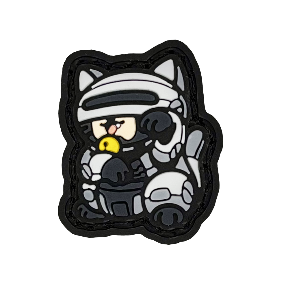 Robocop Neko RE PVC ranger eye morale patch of a robotic cartoon character in a lucky cat maneki-neko pose.