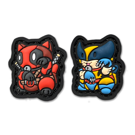 Ronald & Regan Neko RE set PVC ranger eye morale patches of a character in a red suit and another character in a yellow and blue suit sitting in a lucky cat maneki-neko pose.