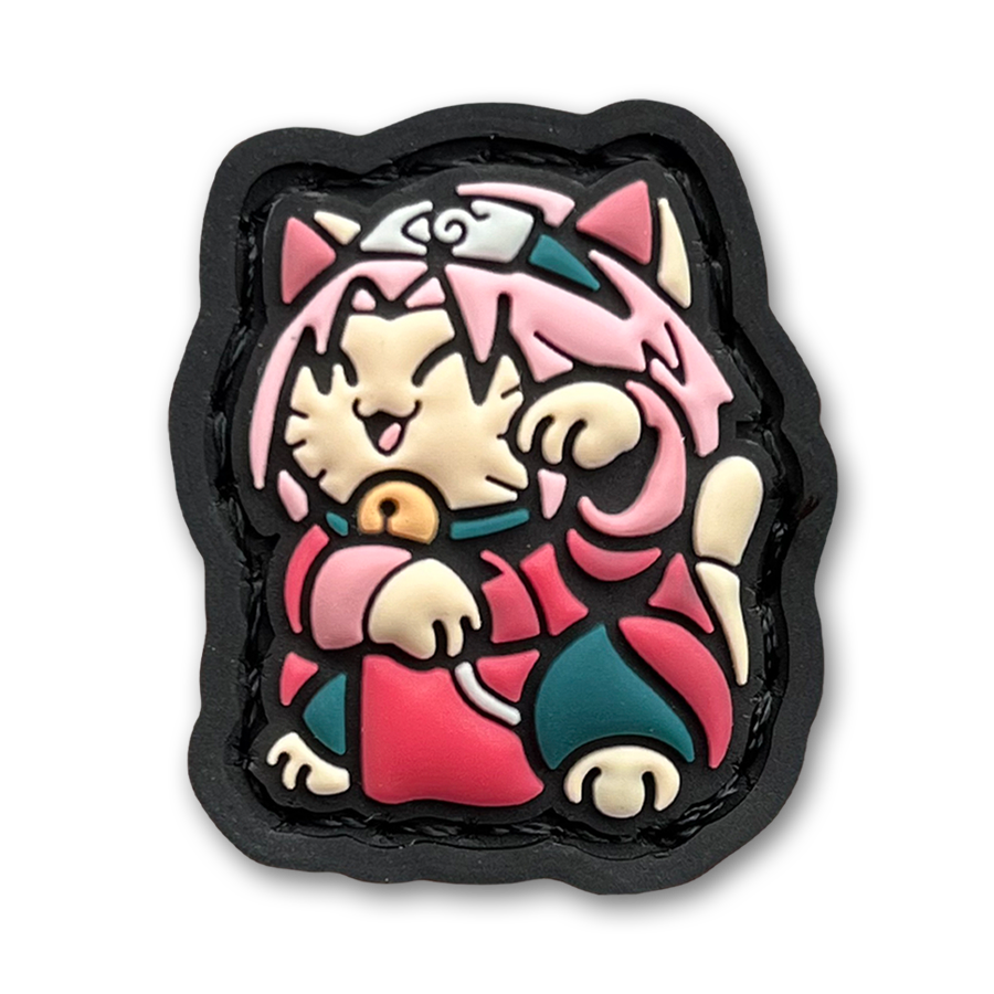 Sakura Neko RE PVC ranger eye morale patch of an anime girl with pink hair in a lucky cat maneki-neko pose.