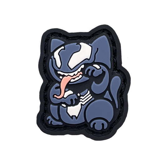 Shadow Parasite Neko RE PVC ranger eye morale patch of a blue cartoon character with its tongue sticking out sitting in a lucky cat maneki-neko pose.