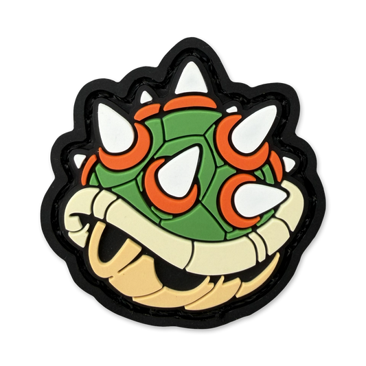 Ranger eye pvc morale patch of a green and orange turtle shell with spikes