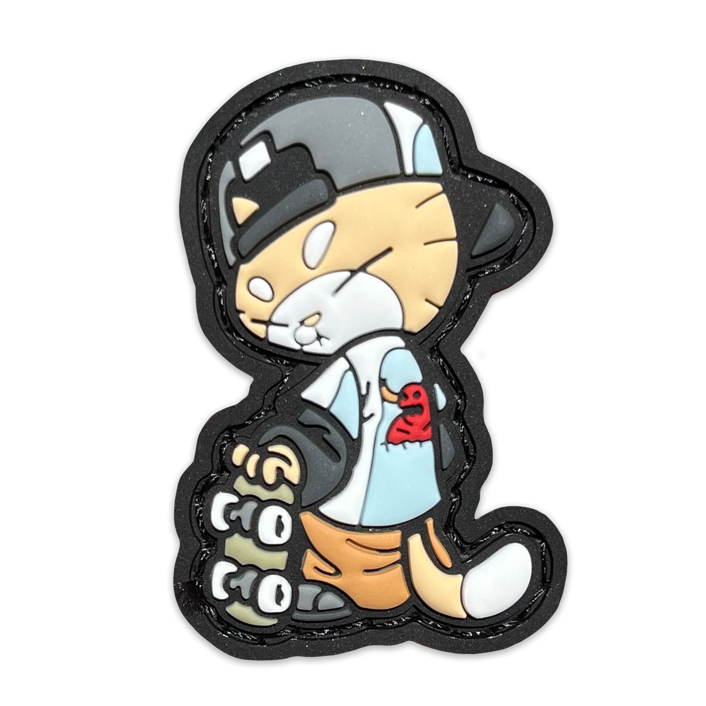 Skate Cato RE PVC ranger eye morale patch of an orange cat wearing a backwards hat and Toy Machine shirt holding a skateboard 