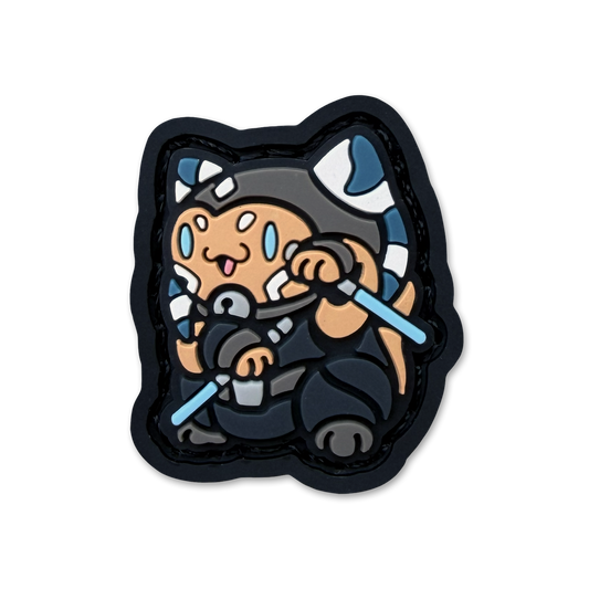 Soka Neko RE ranger eye pvc morale patch of a girl character wielding two blue blades sitting in a lucky cat maneki neko pose.