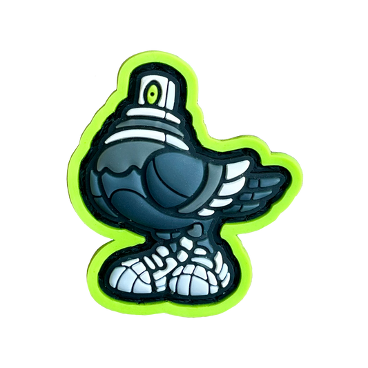 Spraygeon RE PVC ranger eye morale patch of a gray pigeon character with a spray can cap head and tennis shoes and lime green outline.