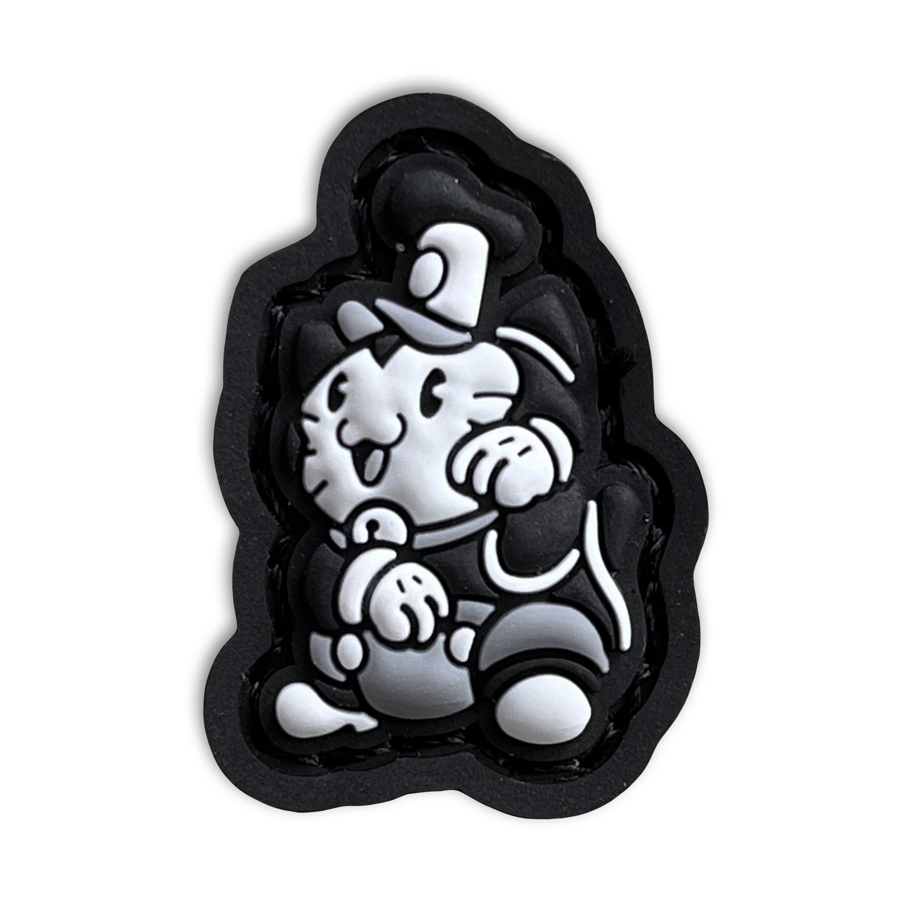 Steamboat Willie Neko RE PVC ranger eye morale patch of a black and white mouse cartoon character wearing a hat sitting in a lucky cat maneki-neko  pose.