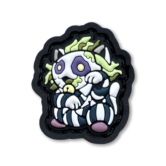 Striped Ghost Neko RE PVC ranger eye morale patch of a character with green hair and striped shirt sitting in a lucky cat maneki-neko pose.