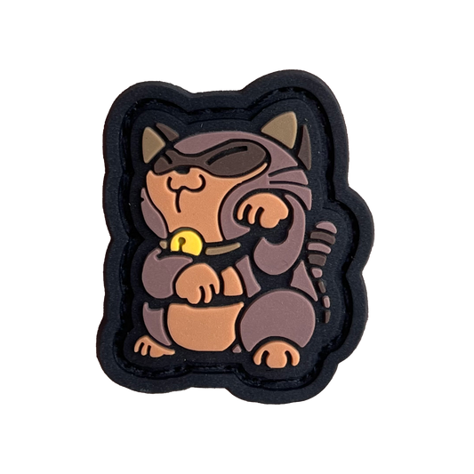 Tanooki Neko RE PVC ranger eye patch of a brown game character in a lucky cat maneki-neko pose.